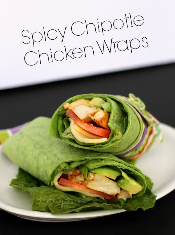 Spicy Chipotle Chicken Wraps stacked together on a plate.